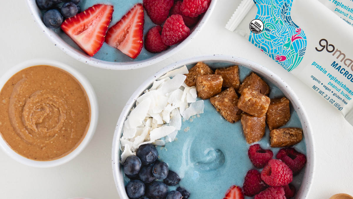 Coconut smoothie bowl topped with GoMacro protein replenishment bar